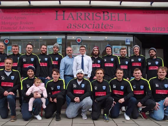Scalby's players line up with sponsors Mark Shields and Karl Goulding from estate agents Harris Bell Associates. Picture: Steve Lilly