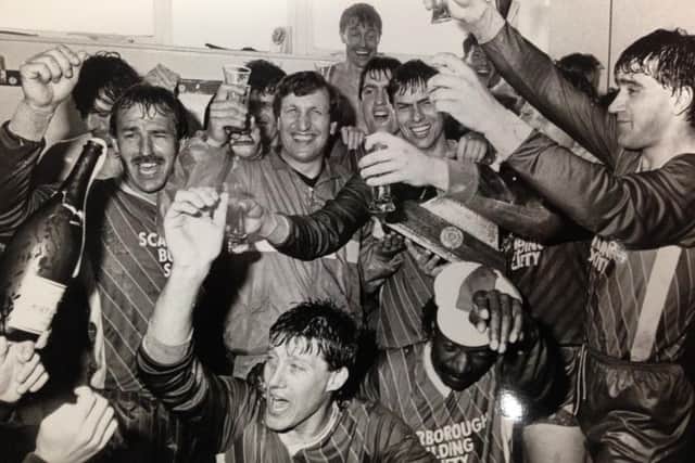 Mitch Cook and his fellow Scarborough FC players celebrate promotion to the Football League