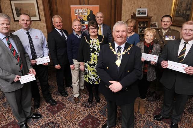 Charity Night Before the Colours Cheque presentation at the Town Hall. Mayor Tom Fox thanks the recipients. David O'Kelly from Yorkshire Regiment Dave Horsley Rnli , John Senior ,Spons John Easby Kudos/HQ Hospitality ,Ros Fox, Nigel Wood Peace of Mind Financial solutions,Tom,Irene Webster ,Beryl Anderson Poppy Appeal, Capt Billy Kelly Royal Dragoon Guards. pic Richard Ponter 160616