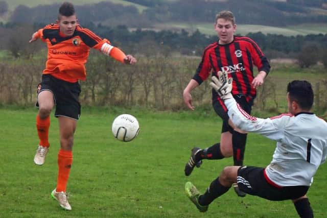 Billy Logan, red and black stripes, in action against Edgehill last month, struck three goals for West Pier in their 6-1 defeat of Seamer Sports