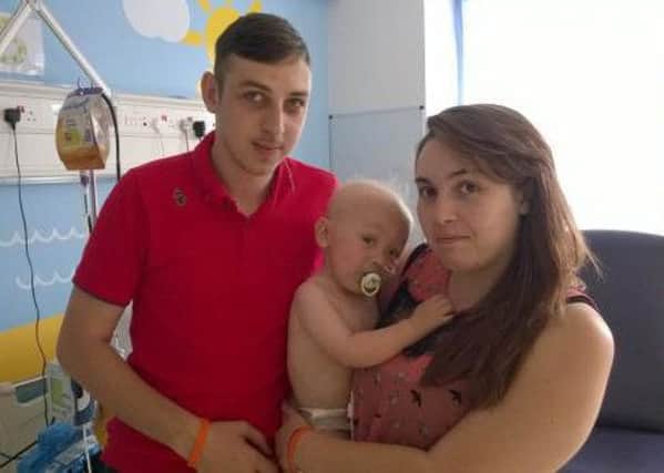 Parents Elisa and Daniel with their son Elliot who lost his battle with cancer at just two years old