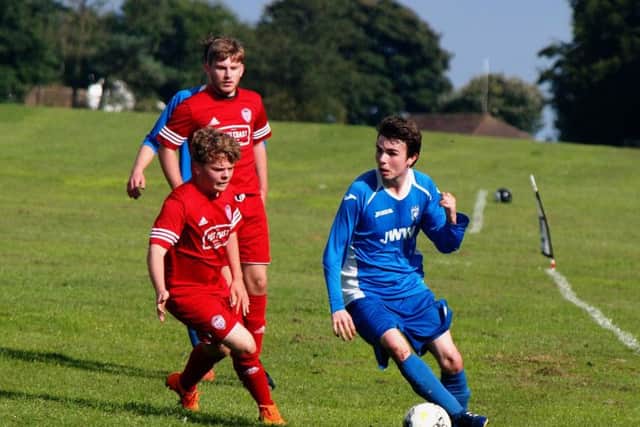 Itis Itis United, red kit, take on Heslerton earlier this season