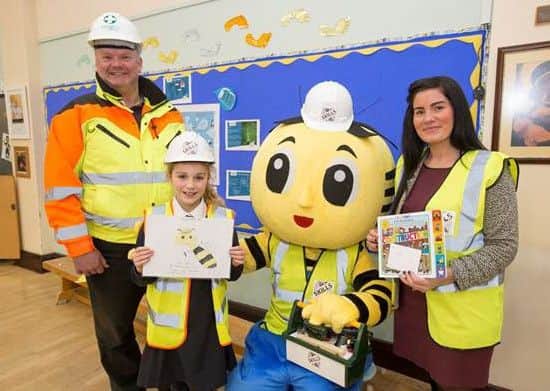 Charlotte Browne with Kebbell Homes site manager Andrew Ramsay and Joanne Hakings from the Skills Village.