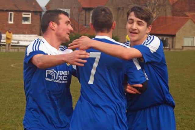 Edgehill Reserves celebrate with goalscorer Tom Scales (centre) during their 3-0 semi-final win at Duchess. Pictures: Steve Lilly.