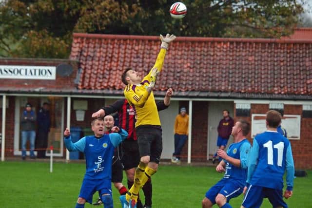 Ayton keeper Shaun Dolan (above) shone in his side's 5-3 win at Cayton Reserves