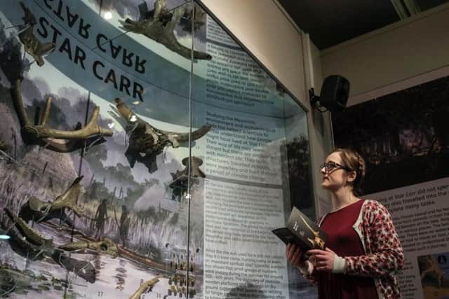 Jennifer Dunne, Collections Manager at Scarborough Museums Trust, with the Star Carr display at The Rotunda Museum .
