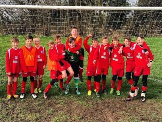 Scarborough and District under-11s celebrate their win at Derby