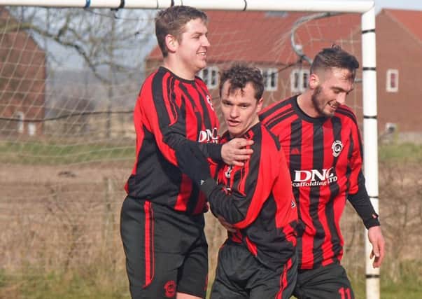 West Pier's players celebrate a goal during their County Cup win over Whitby Fishermen. Pictures: Steve Lilly
