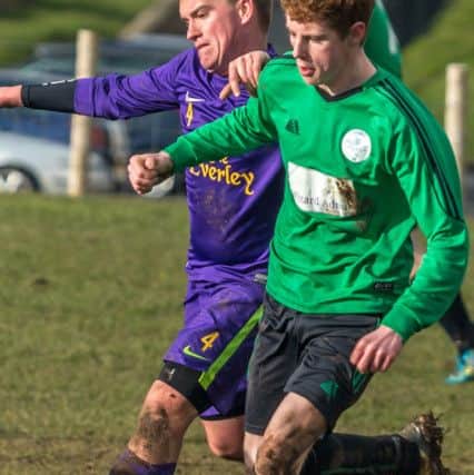Goal Sports' player-manager Mark Plumpton battles for possession during his side's loss to Sleights Reserves. Pictures: Brian Murfield
