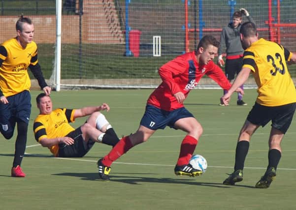 Ayton (red) go on the attack during their demolition of Alma. Pictures: Steve Lilly