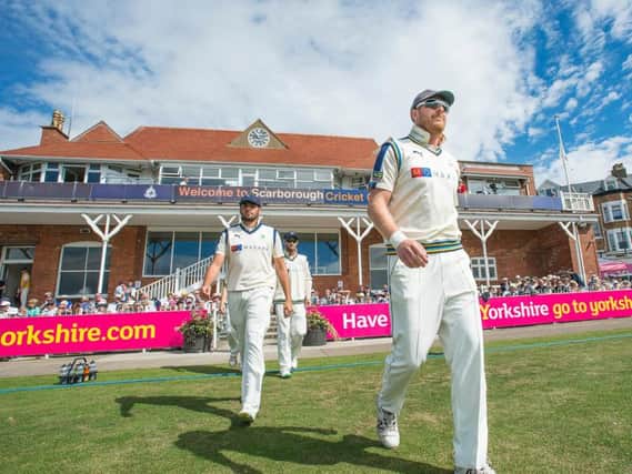 Andrew Gale (above) leading his Yorkshire side out at Scarborough CC's North Marine Road.