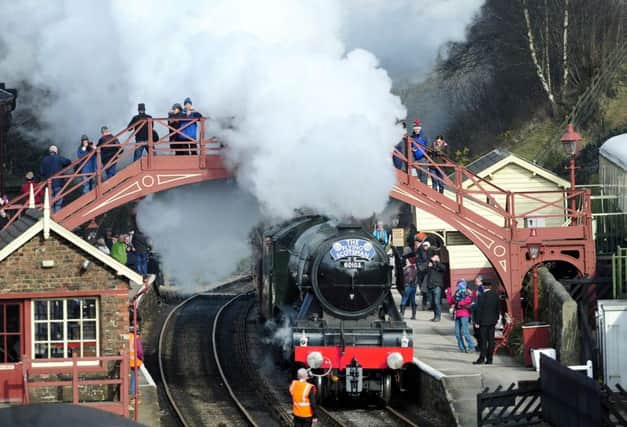 The Flying Scotsman steams through Goathland station, made famous in the Heartbeat TV series, in the North York Moors National Park, on its way from Grosmont to Pickering on its first day on the North Yorks Moors Railway.