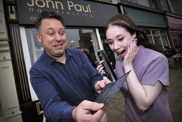 Reading a special Salon Poem at John Pauls . John Paul Crawford and Charlotte Dingley look amazed at the poem. pic Richard Ponter 161107a