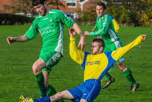 FC Rosette's Wayne Shaw (yellow kit) scored the winner in his side's victory over Goal Sports