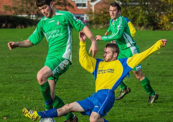 FC Rosette's Wayne Shaw (yellow kit) scored the winner in his side's victory over Goal Sports