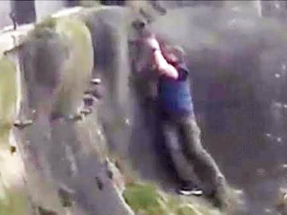 Daring Kieron Le-mar, 36, shot into action when he saw the dog - that wasn't his pet - was perched on the perilous cliff