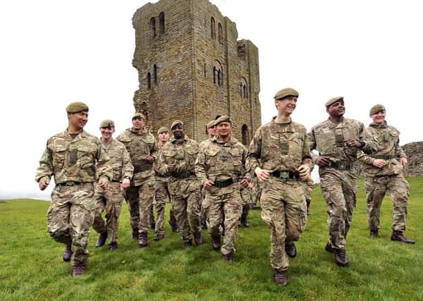 The Yorkshire Regiment 2ND Battalion  2 Yorks are all smiles as they converge on Scarborough Castle after their challenging walk across Yorkshire. Pic Richard Ponter 1612121a