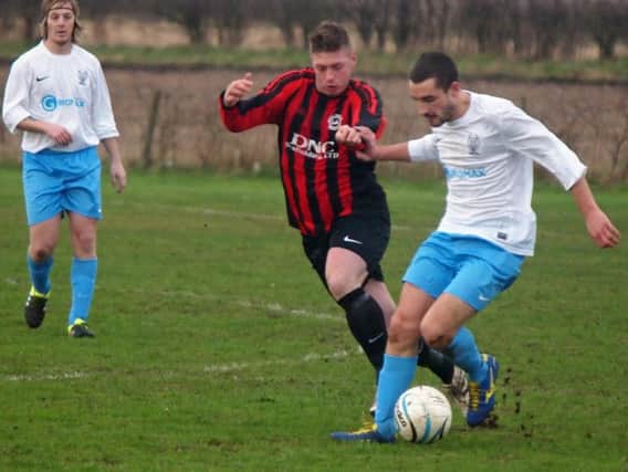 Will Jenkinson (red and black kit) scored a header as West Pier battled back from 4-1 down to draw 4-4 at Edgehill
