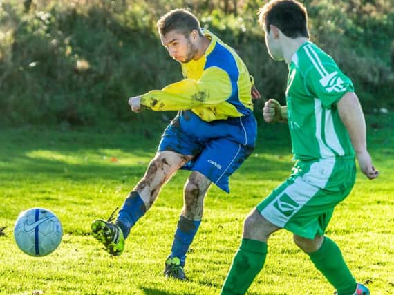 Wayne Shaw (yellow) had a hand in Rosette's second goal in their 4-3 win at Filey Town Thirds