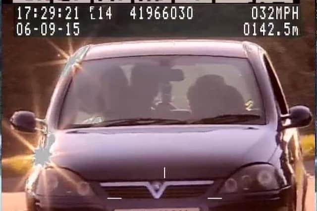 Sarup's car approaches the police vehicle
