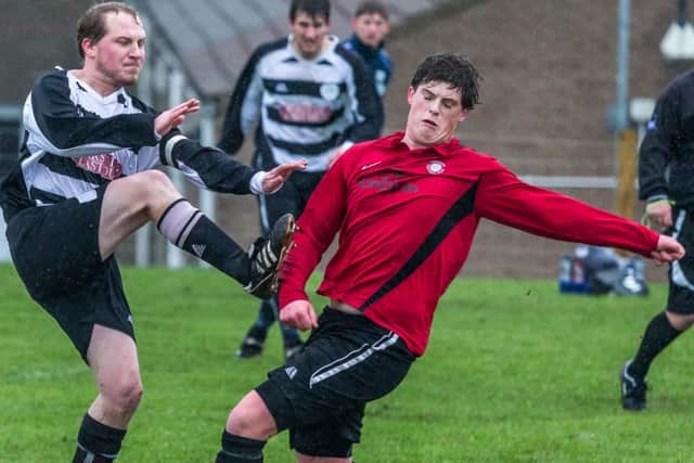 Sherburn, red kit, secured a home win over Eastway Sports on Wednesday night