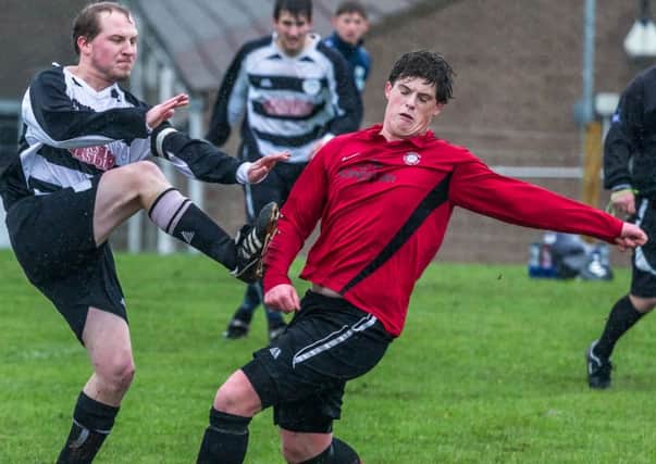 Sherburn, red kit, secured a home win over Eastway Sports on Wednesday night