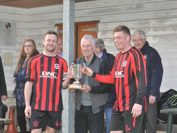 Pier's Gary Thomas & Will Jenkinson collect the trophy from former winner Pete Chapman