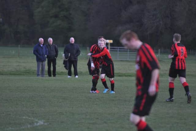Chris Weetman celebrates his goal for Pier