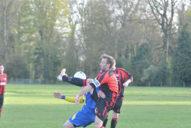Gary Thomas challenges for the ball in their win against Seamer