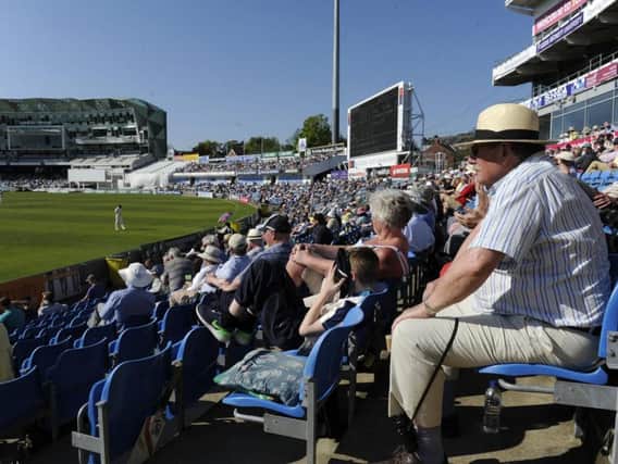 Fans enjoy cricket in the sun in Leeds on Monday.