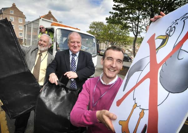 Scarborough Council unveil their new seagull proof bags. David Bebbington ,with Cllr Godfrey Allanson ,Andrew Jenkinson,Waste Manager Harry Briggs. pic Richard Ponter 162102b 162101a