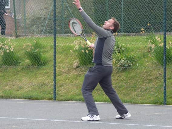 Richard Stacey of Scarborough Pindar C is pictured serving