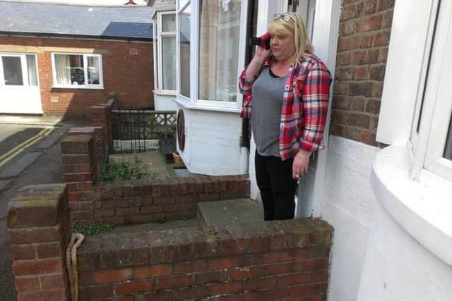 Shelly Malone was shocked to find a snake on her wall