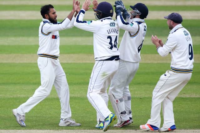 Yorkshire's Adil Rashid is congratulated on the wicket of Lancashire's Haseeb Hameed.