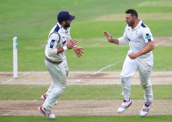 Liam Plunkett congratulates Yorkshire's Tim Bresnan after the fall of Lancashire's Steven Croft.
Pictures: Alex Whitehead/SWpix.com