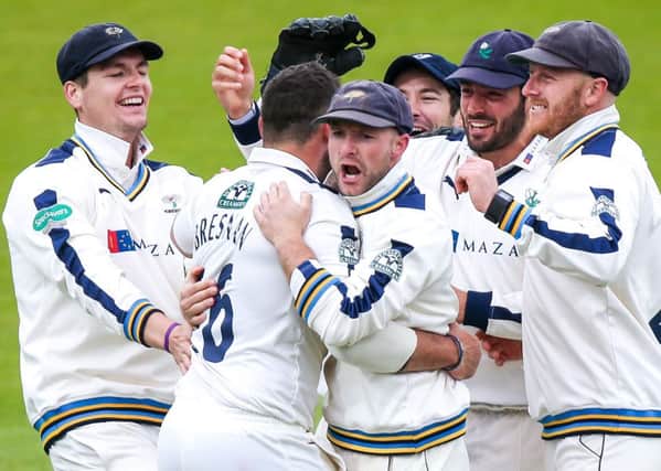 Yorkshire's Tim Bresnan (second left) is congratulated on the wicket of Lancashire's Steven Croft.