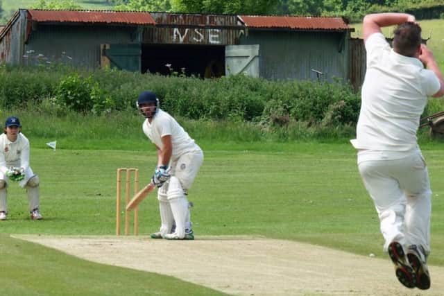 Seamer's Adam Morris bowls to James Ledden during his side's Premier Division victory at Scalby