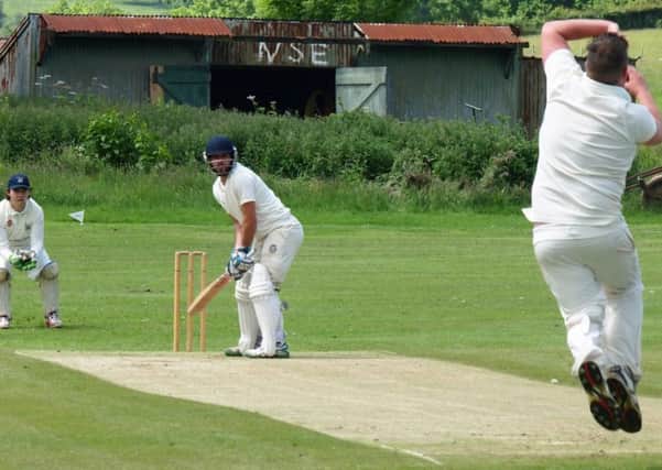 Seamer's Adam Morris bowls to James Ledden during his side's Premier Division victory at Scalby