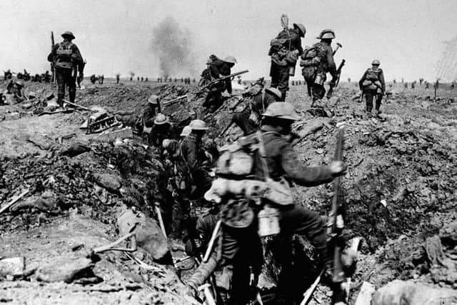 Library filer dated 25/09/1916 of British troops negotiating a trench as they go forward in support of an attack on the village of Morval during the Battle of the Somme. The date of July 1, 1916, is remembered as the bloodiest day in the history of the British Army. PRESS ASSOCIATION Photo. Issue date: Sunday June 25, 2006. The Battle of the Somme began at 7.30am that day, and by the following morning 19,240 British soldiers had died. The battle continued for more than four months, leaving a final casualty tally for all sides of well over a million. See PA story WAR Somme History. Photo credit should read: PA.