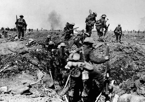 Library filer dated 25/09/1916 of British troops negotiating a trench as they go forward in support of an attack on the village of Morval during the Battle of the Somme. The date of July 1, 1916, is remembered as the bloodiest day in the history of the British Army. PRESS ASSOCIATION Photo. Issue date: Sunday June 25, 2006. The Battle of the Somme began at 7.30am that day, and by the following morning 19,240 British soldiers had died. The battle continued for more than four months, leaving a final casualty tally for all sides of well over a million. See PA story WAR Somme History. Photo credit should read: PA.