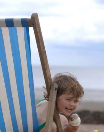 22nd May 2009.
Weather Picture for Bank Holiday weekend.
Pictured 4 year old Connie Barker from Borough Bridge takes advantage of a teacher training day to enjoy an icecream on the South Bay Beach at Scarborough on a day visit to the coast.
Picture by Gerard Binks