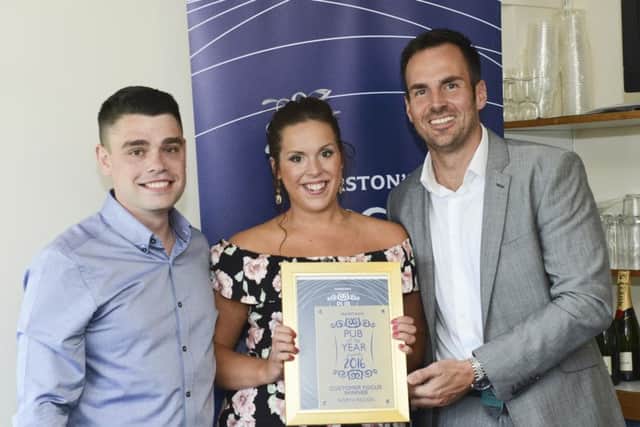 The Crown Taverns Natalie Hodgson and Steven Murray collect their Marstons Pub of the Year awards.
