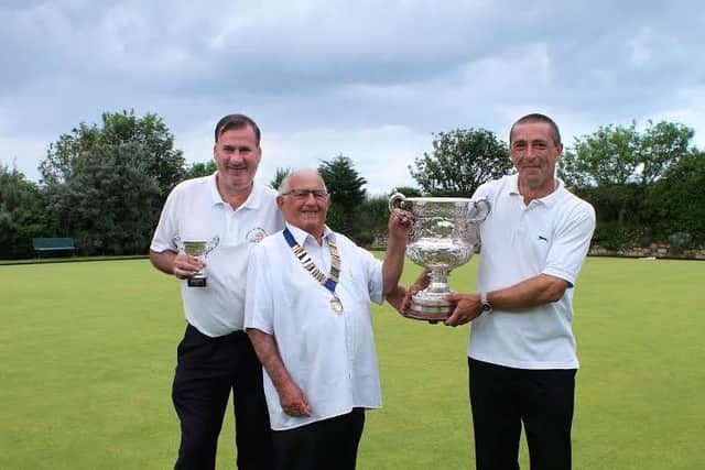 S&DCGBA president Mick Hill presents the Boyes Cup to Gary Puleston with runner-up Kenny Wale looking on