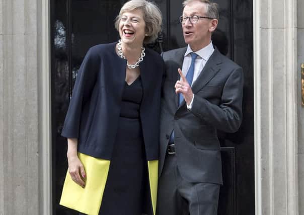 Theresa May on the steps of 10 Downing Street with her husband, Philip.