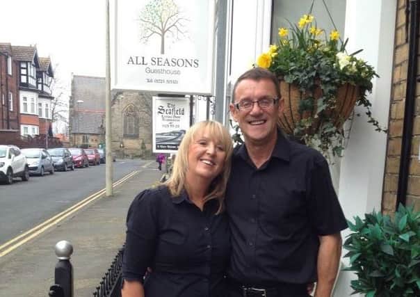 Lesley and Andrew Burr outside the All Seasons Guesthouse.