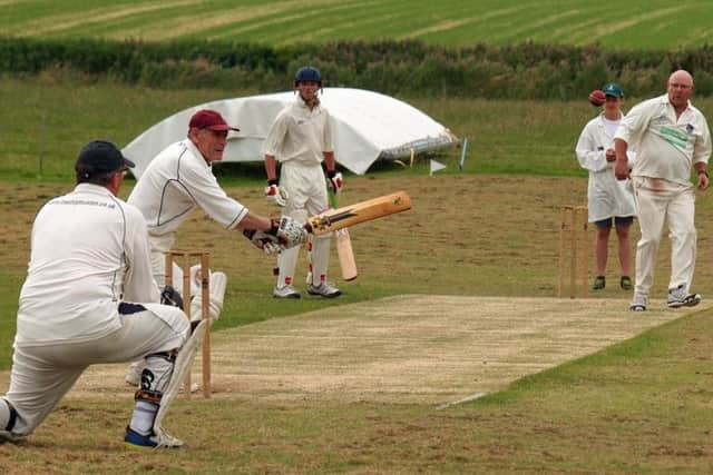 Muston 2nds' bowler Brian Anderson sends down a delivery during his side's win against Thornton Dale 2nds in Division Five. Picture: Steve Lilly.