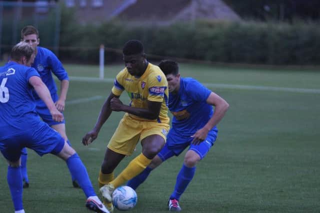 Benny Igiehon weaves through the Pickering defence
