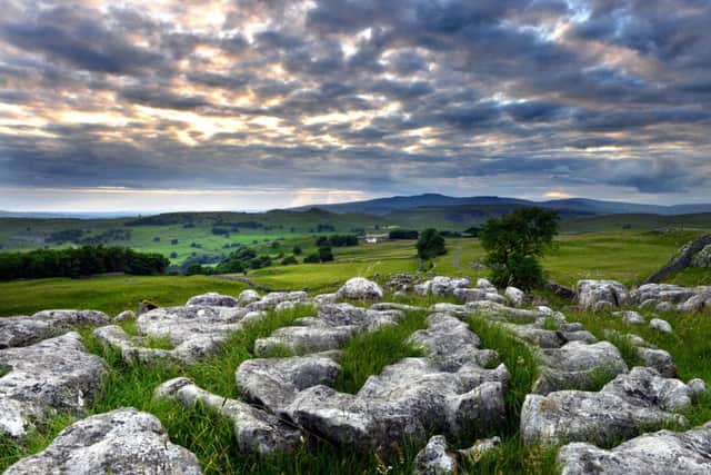 A Yorkshire scene: Looking across to Ingleborough from the limestone outcrops above Stainforth as the sun goes down. Picture: Bruce Rollinson