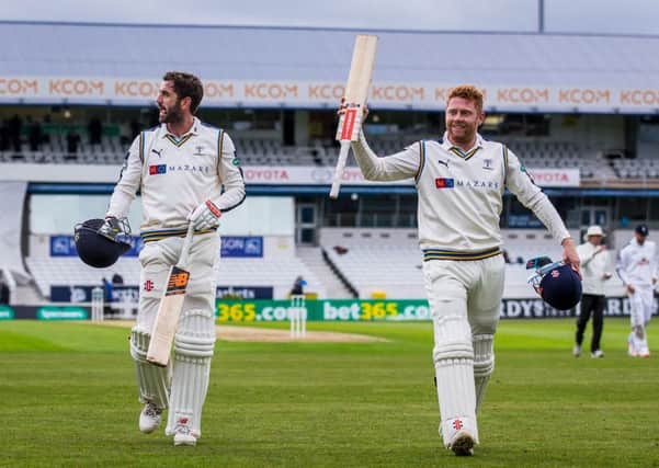 Yorkshire's Jonny Bairstow celebrates his double century as he and Liam Plunkett walk off for the lunch interval on day two against Hampshire at Headingley back in April. Picture by Alex Whitehead/SWpix.com
