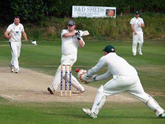 Jamie Nesfield's delivery flies down the leg side during Flixton's home defeat against Selby in Division One. Picture: Steve Lilly.